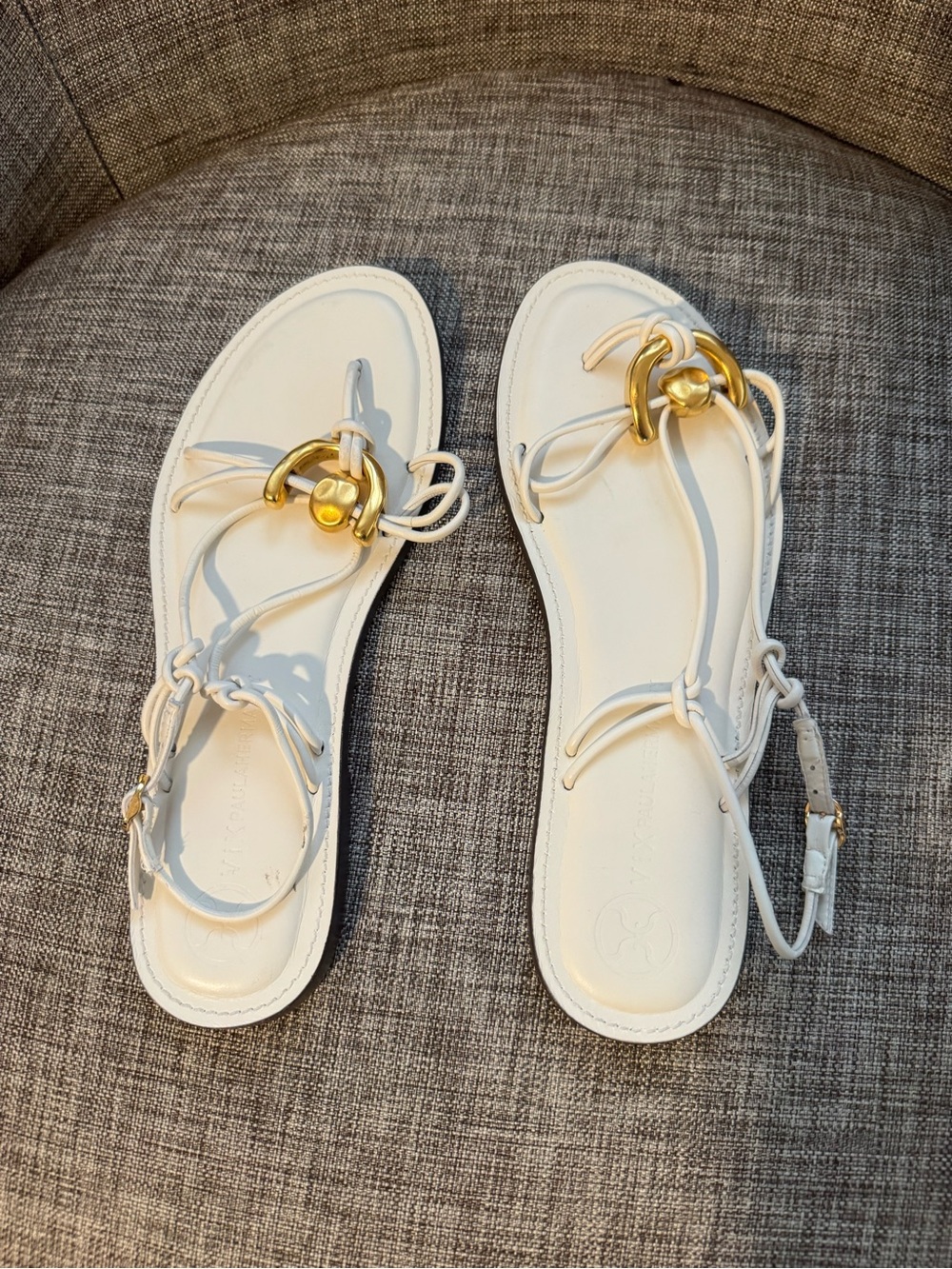 Vix Paule Hermanny white Ankle strap flat Sandals with gold hardware Accents.